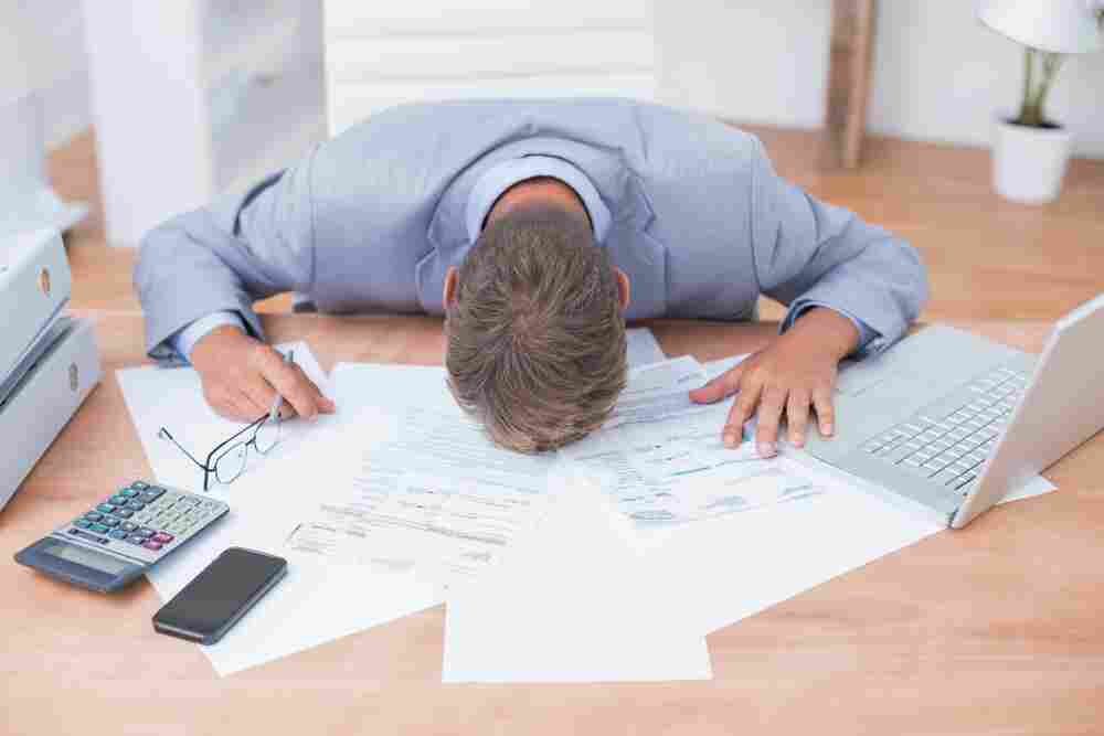 Businessman being depressed by accounting in his office-1 (2)